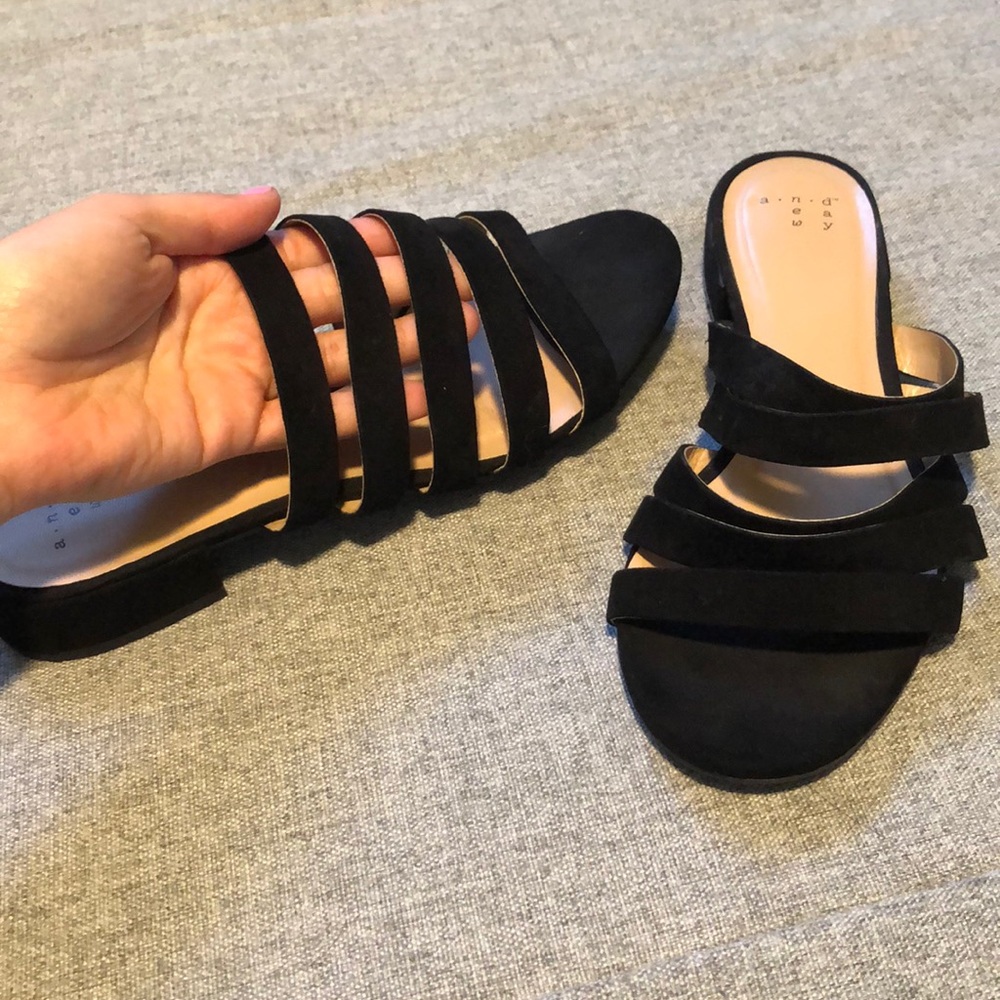 Strapped black slip on sandals with small heel